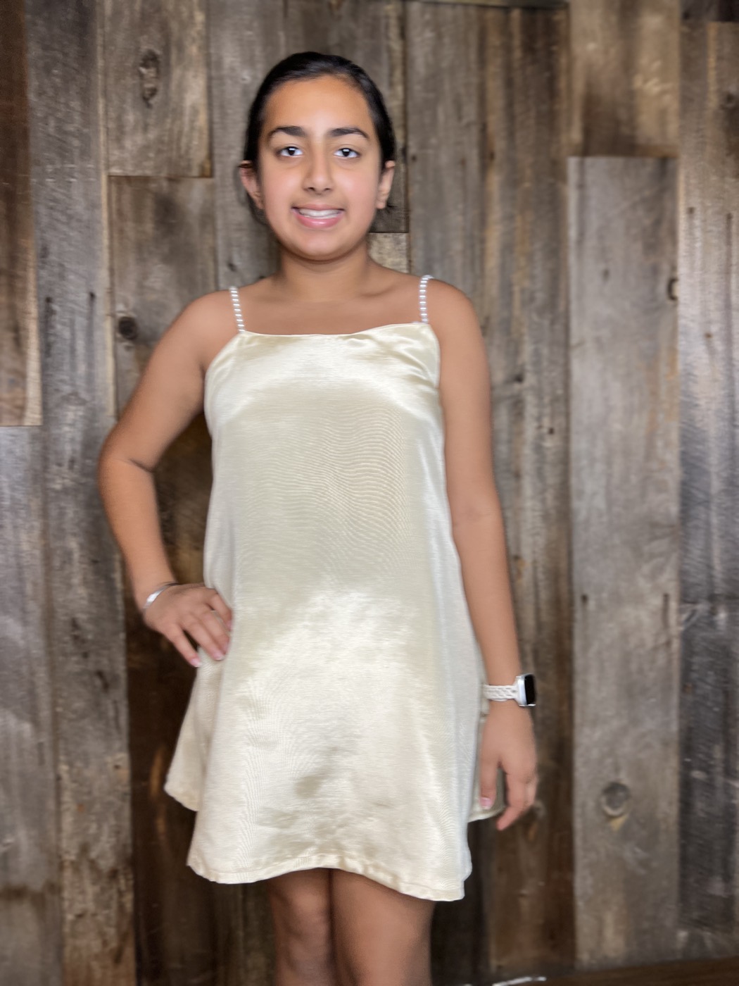 Young designer in a satin slip dress she made