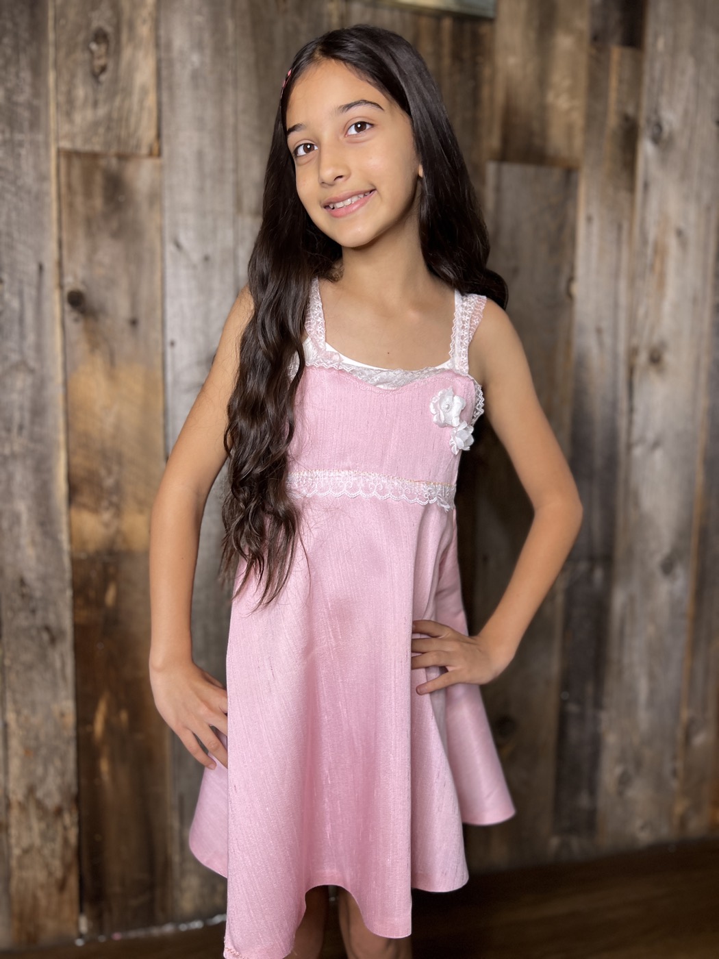 Young designer in a lace-trim dress she made