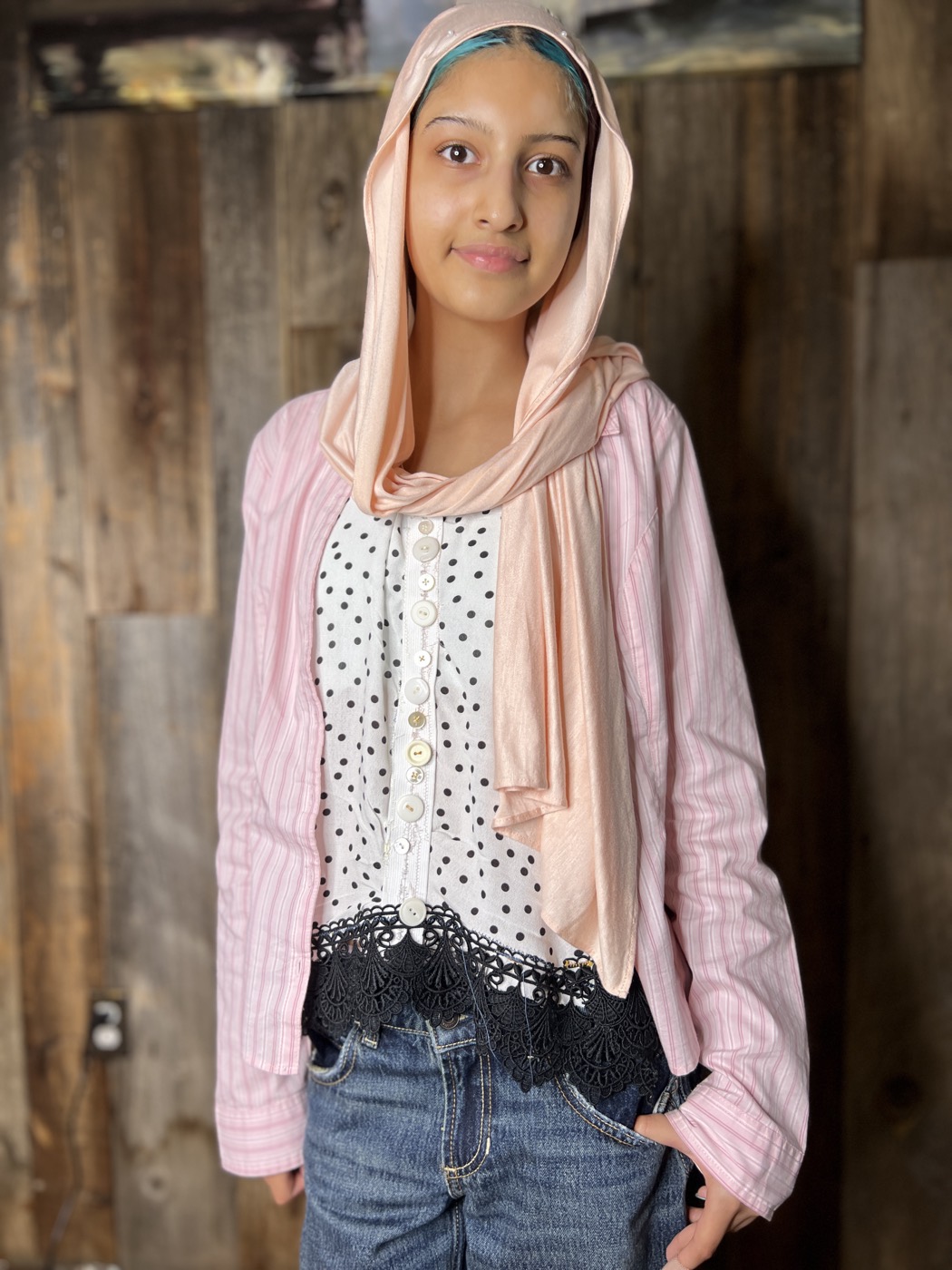 Young designer in a layered street look she made